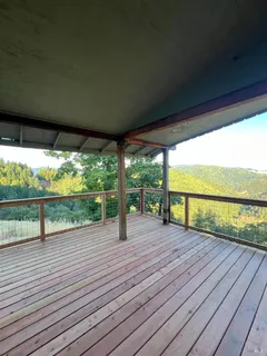 a view of porch with wooden floor