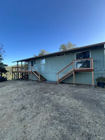 a view of balcony with wooden floor