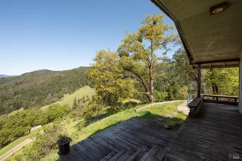a view of balcony with wooden floor