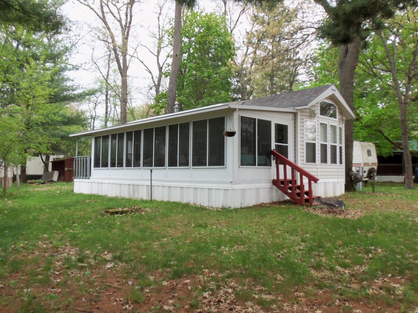 a view of a house with a yard and deck