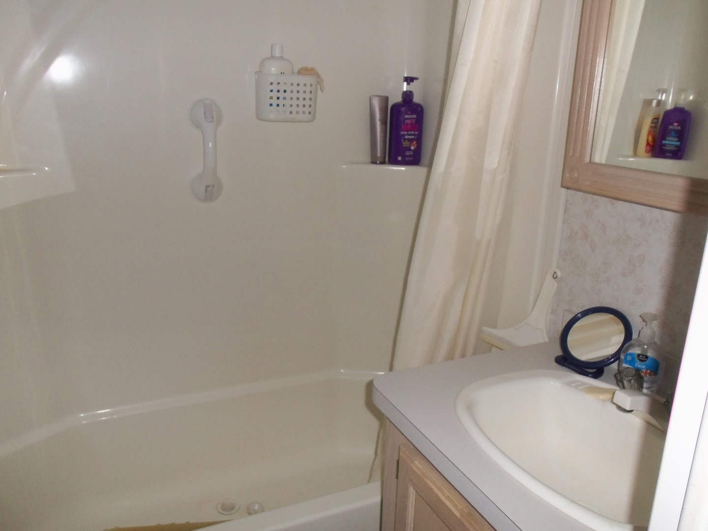 7-150 Woodhaven Sublette, IL 61367 - Photo 15 of 16 a bathroom with a sink a toilet and a tub