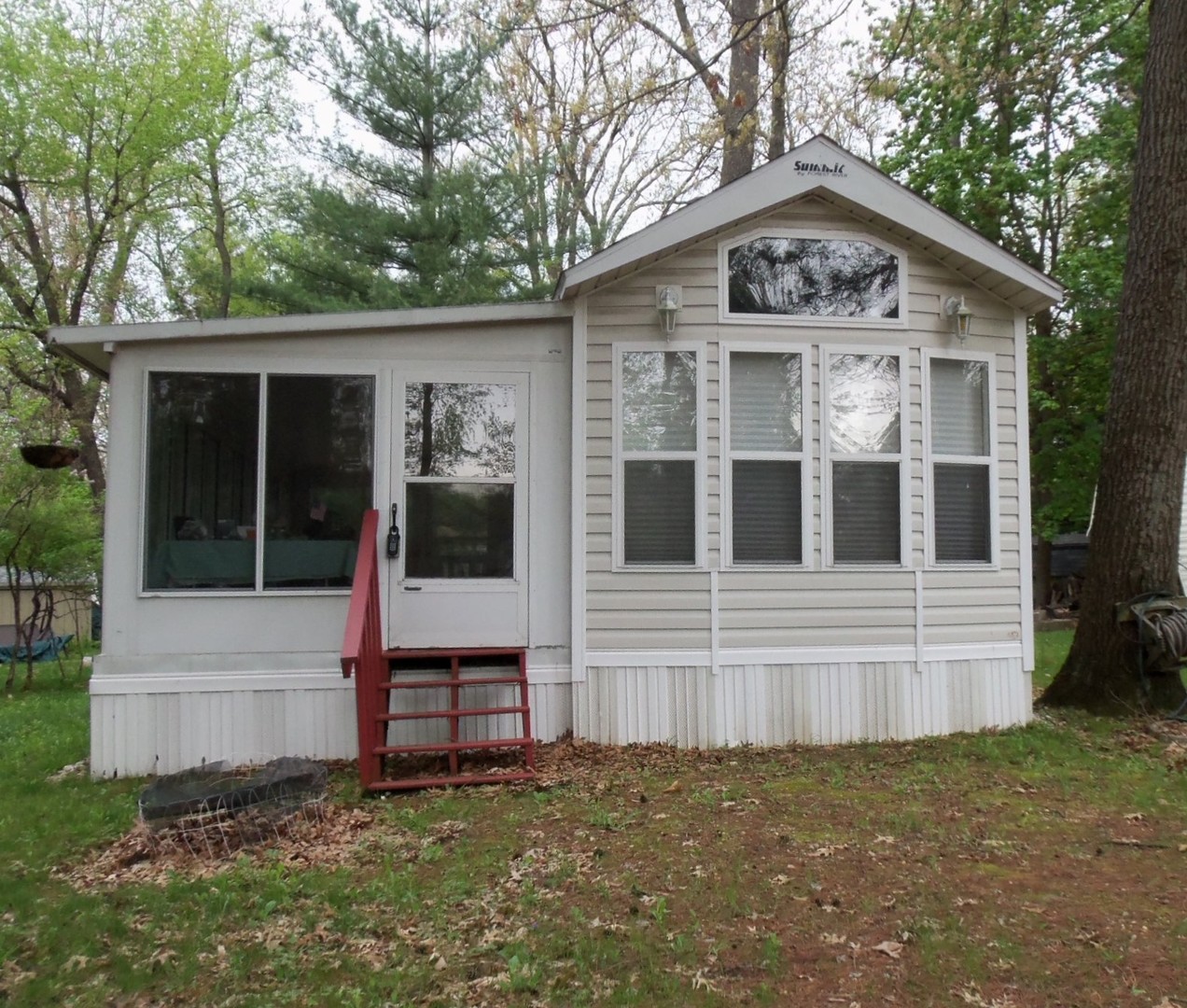 7-150 Woodhaven Sublette, IL 61367 - Photo 2 of 16 a front view of a house with a yard