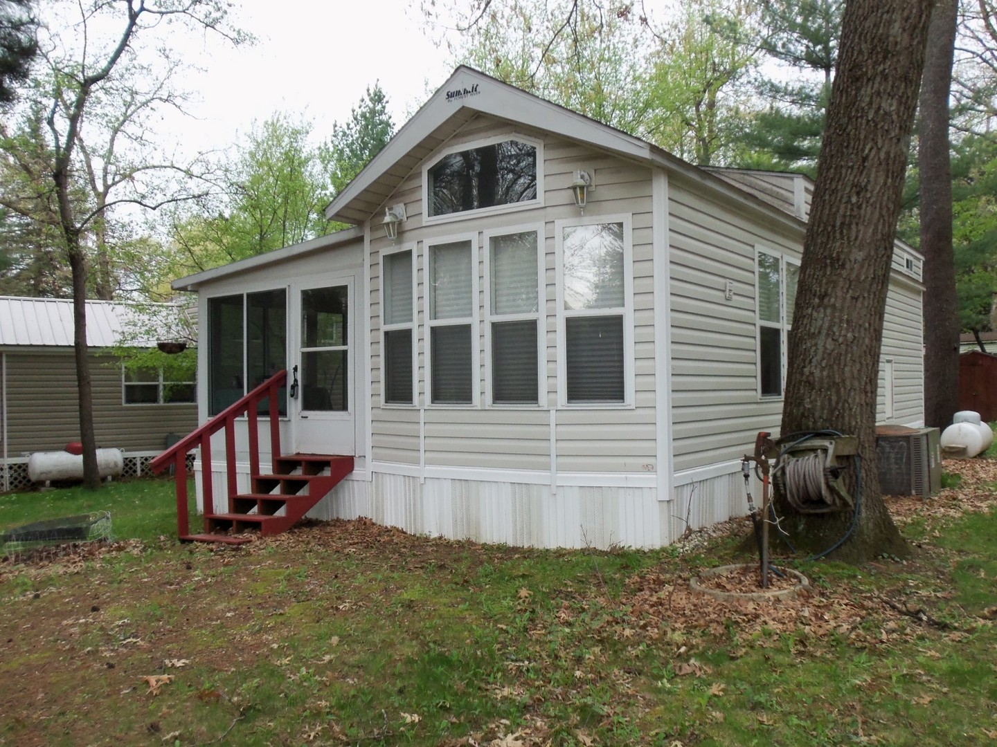7-150 Woodhaven Sublette, IL 61367 - Photo 3 of 16 a view of a house with a yard