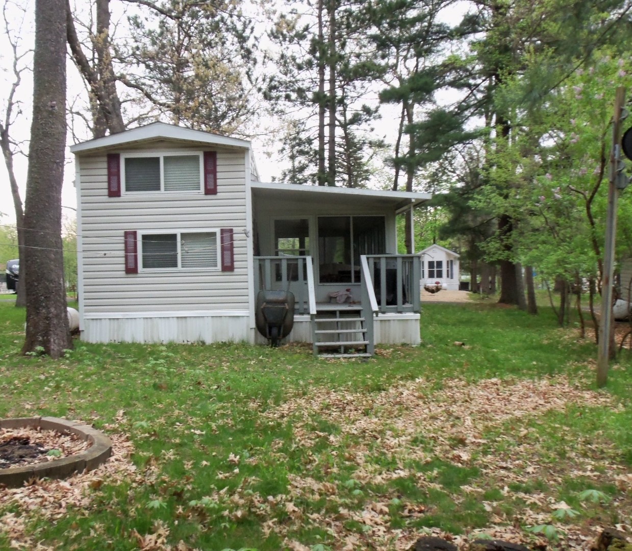 7-150 Woodhaven Sublette, IL 61367 - Photo 4 of 16 a view of a house with backyard porch and sitting area