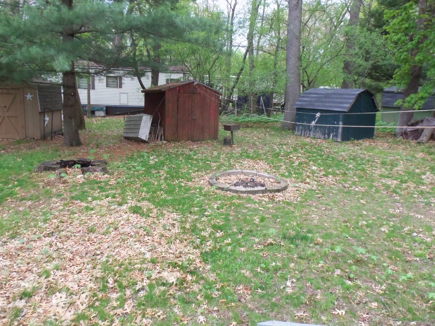 7-150 Woodhaven Sublette, IL 61367 - Photo 5 of 16 a backyard of a house with table and chairs