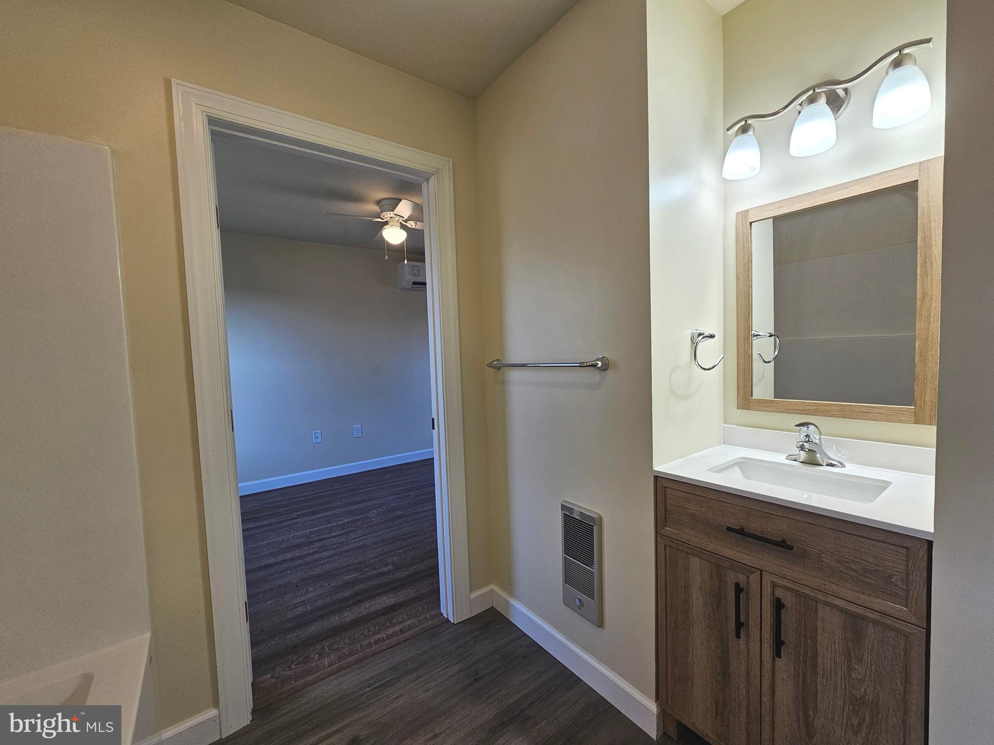 26404 Franklin Road Crisfield, MD 21817 - Photo 22 of 31 a bathroom with a sink and a mirror