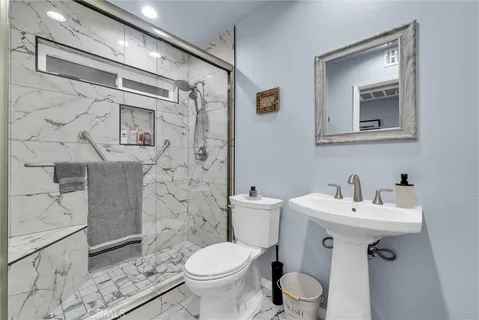 a living room with fireplace furniture and a floor to ceiling window