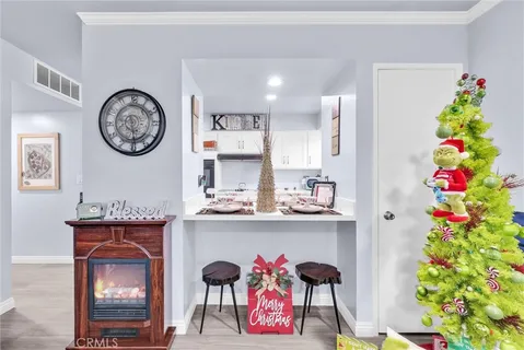a kitchen with stainless steel appliances kitchen island granite countertop a refrigerator and sink