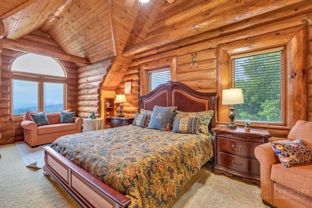 160 Outback Road Ferguson, NC 28624 - Photo 29 of 49 a bedroom with a bed and window
