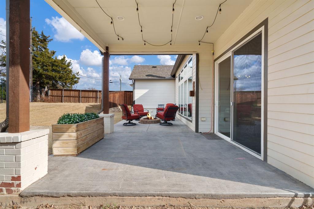 313 East 3rd Street Prosper, TX 75078 - Photo 28 of 38 a view of a porch with seating space