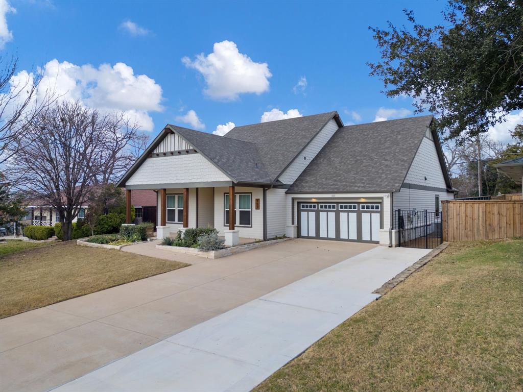 313 East 3rd Street Prosper, TX 75078 - Photo 34 of 38 a front view of a house with yard and trees