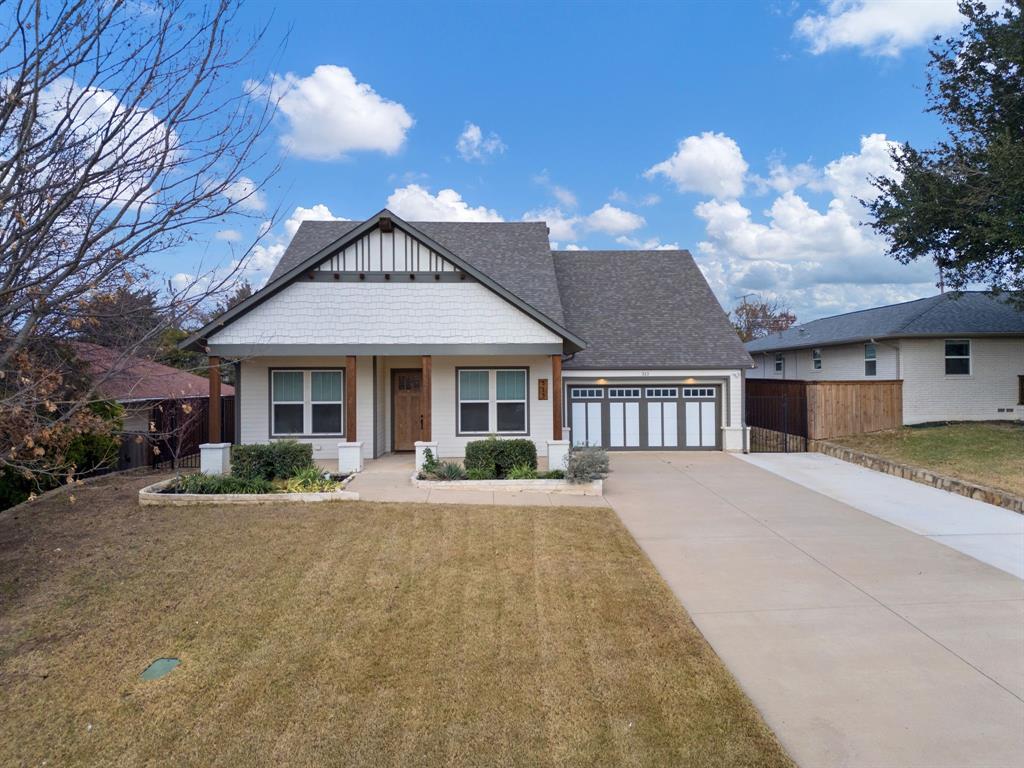 313 East 3rd Street Prosper, TX 75078 - Photo 35 of 38 a front view of a house with a yard