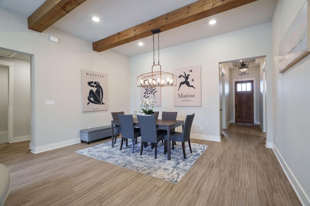 313 East 3rd Street Prosper, TX 75078 - Photo 7 of 38 a view of a dining room with furniture window and wooden floor