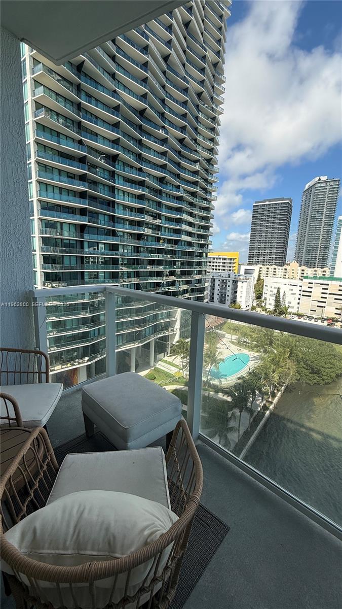 601 Northeast 27th Street, Unit 1003 Miami, FL 33137 - Photo 17 of 31 a view of balcony with couch and chairs