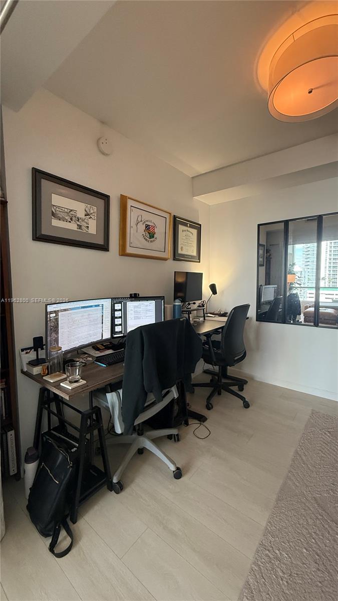 601 Northeast 27th Street, Unit 1003 Miami, FL 33137 - Photo 22 of 31 a view of a workspace with a window and chair