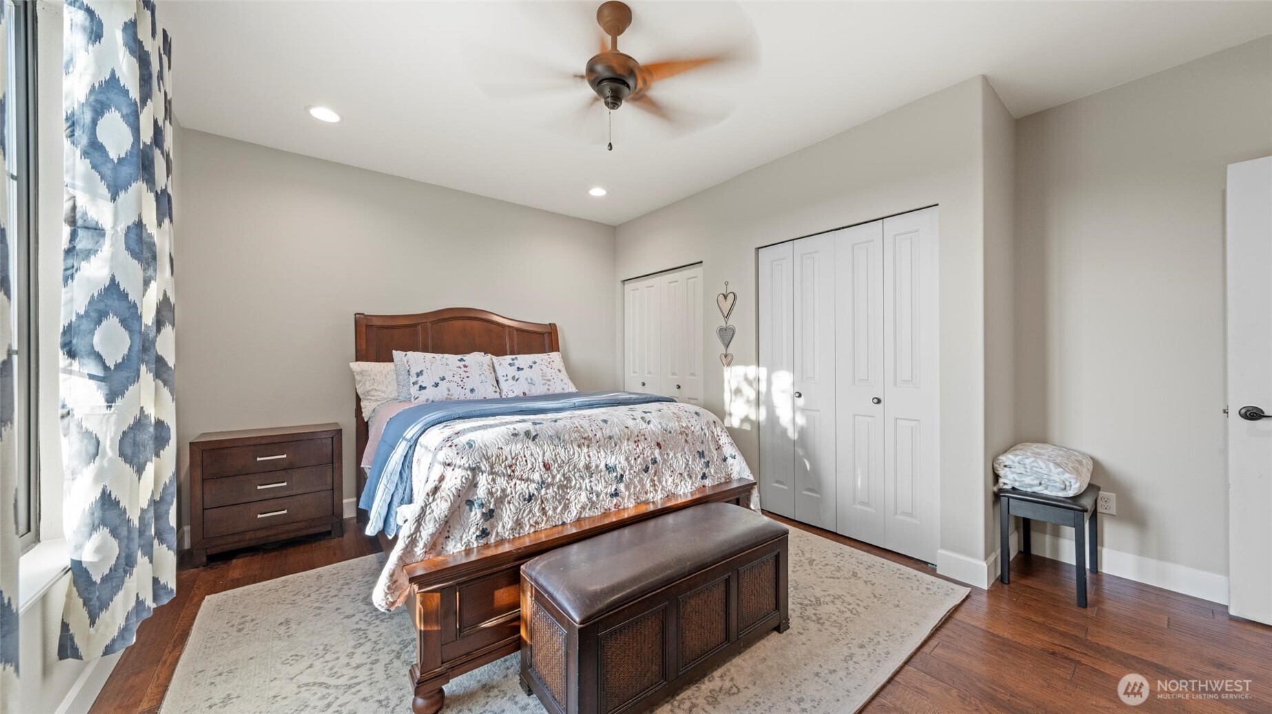 1279 Woodward Canyon Road Touchet, WA 99360 - Photo 20 of 35 a bedroom with a bed and a chandelier