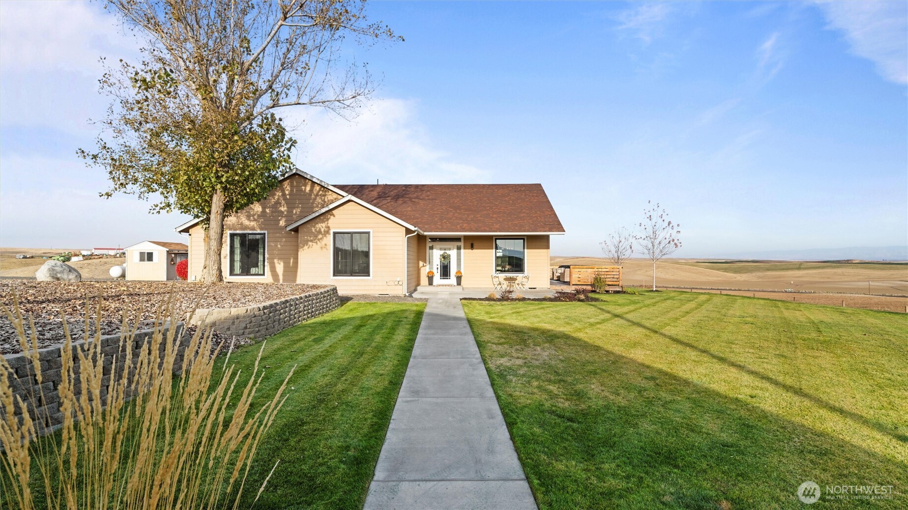 1279 Woodward Canyon Road Touchet, WA 99360 - Photo 2 of 35 a front view of a house with a yard