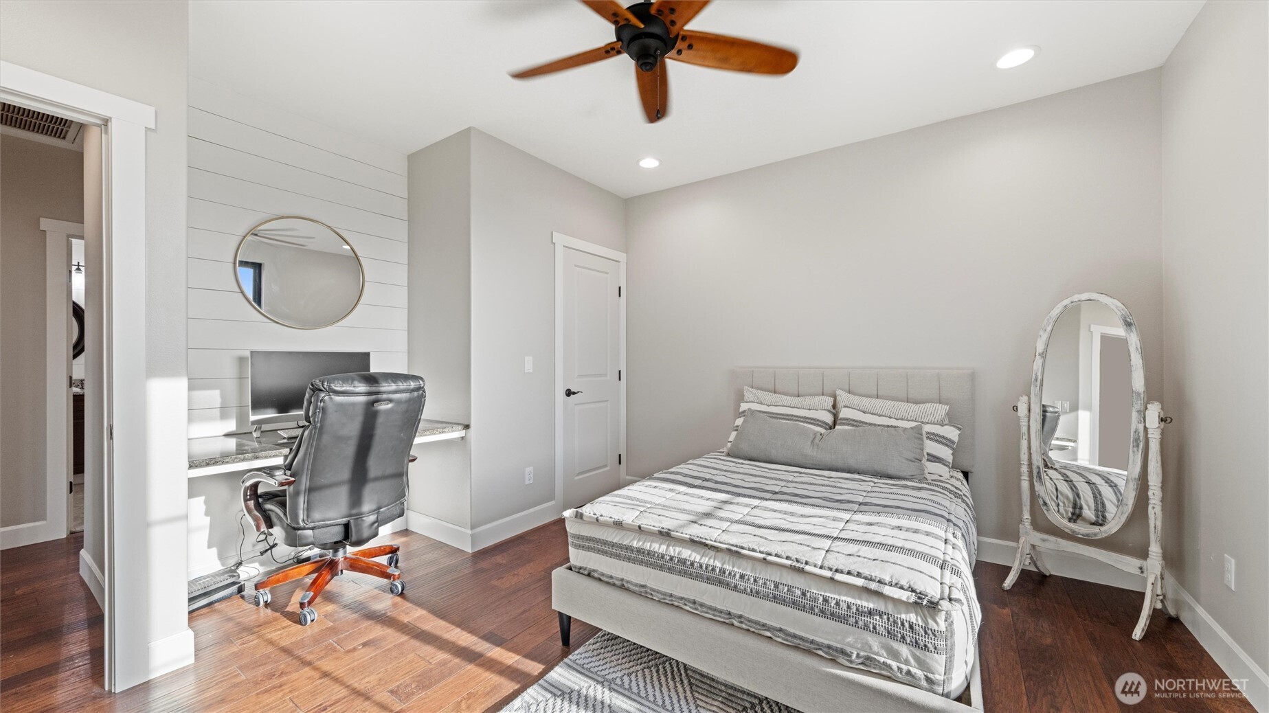 1279 Woodward Canyon Road Touchet, WA 99360 - Photo 24 of 35 a bedroom with a bed and a chandelier