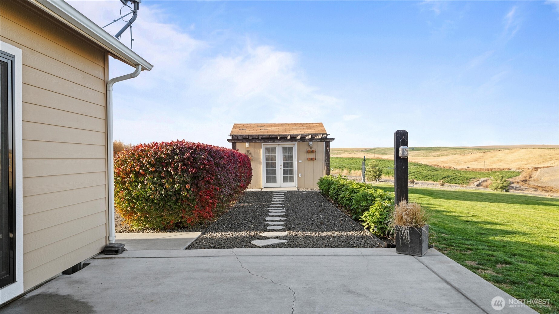 1279 Woodward Canyon Road Touchet, WA 99360 - Photo 28 of 35 a front view of a house with a yard and ocean view