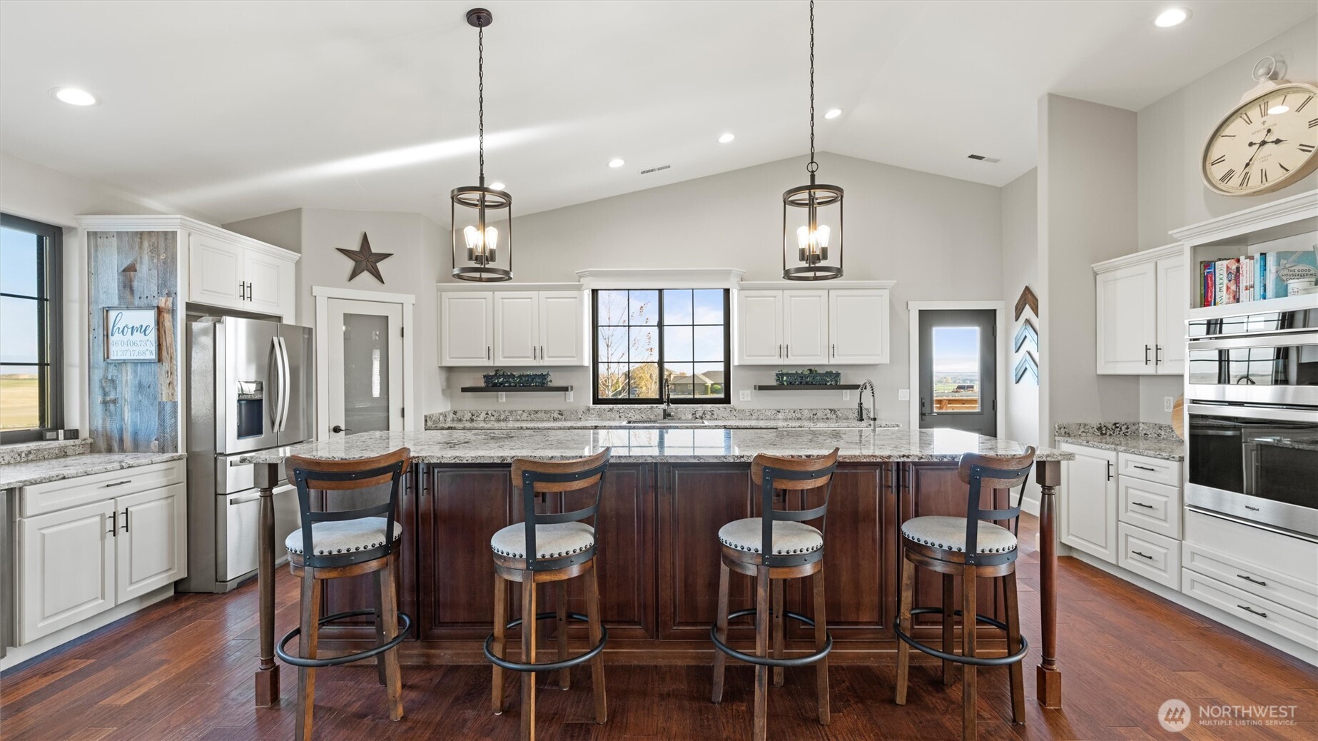 1279 Woodward Canyon Road Touchet, WA 99360 - Photo 7 of 35 a kitchen with granite countertop stainless steel appliances and chairs