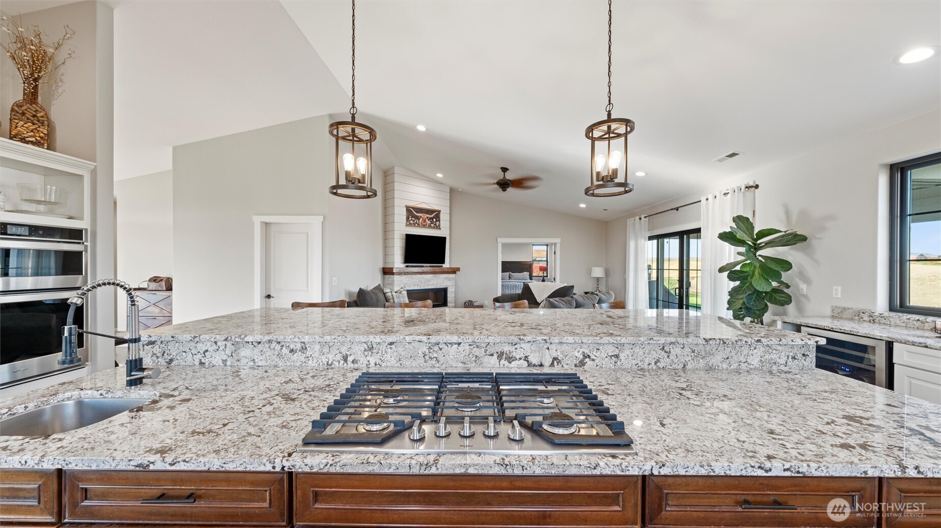 1279 Woodward Canyon Road Touchet, WA 99360 - Photo 8 of 35 a view of a kitchen with granite countertop a sink and a stove