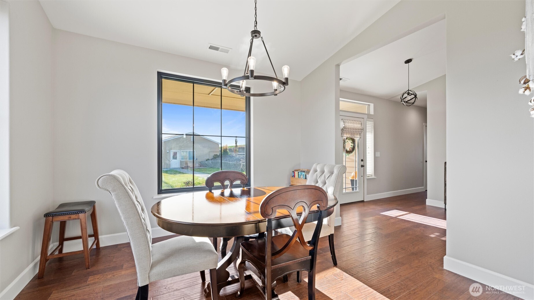 1279 Woodward Canyon Road Touchet, WA 99360 - Photo 10 of 35 a view of a dining room with furniture window and wooden floor