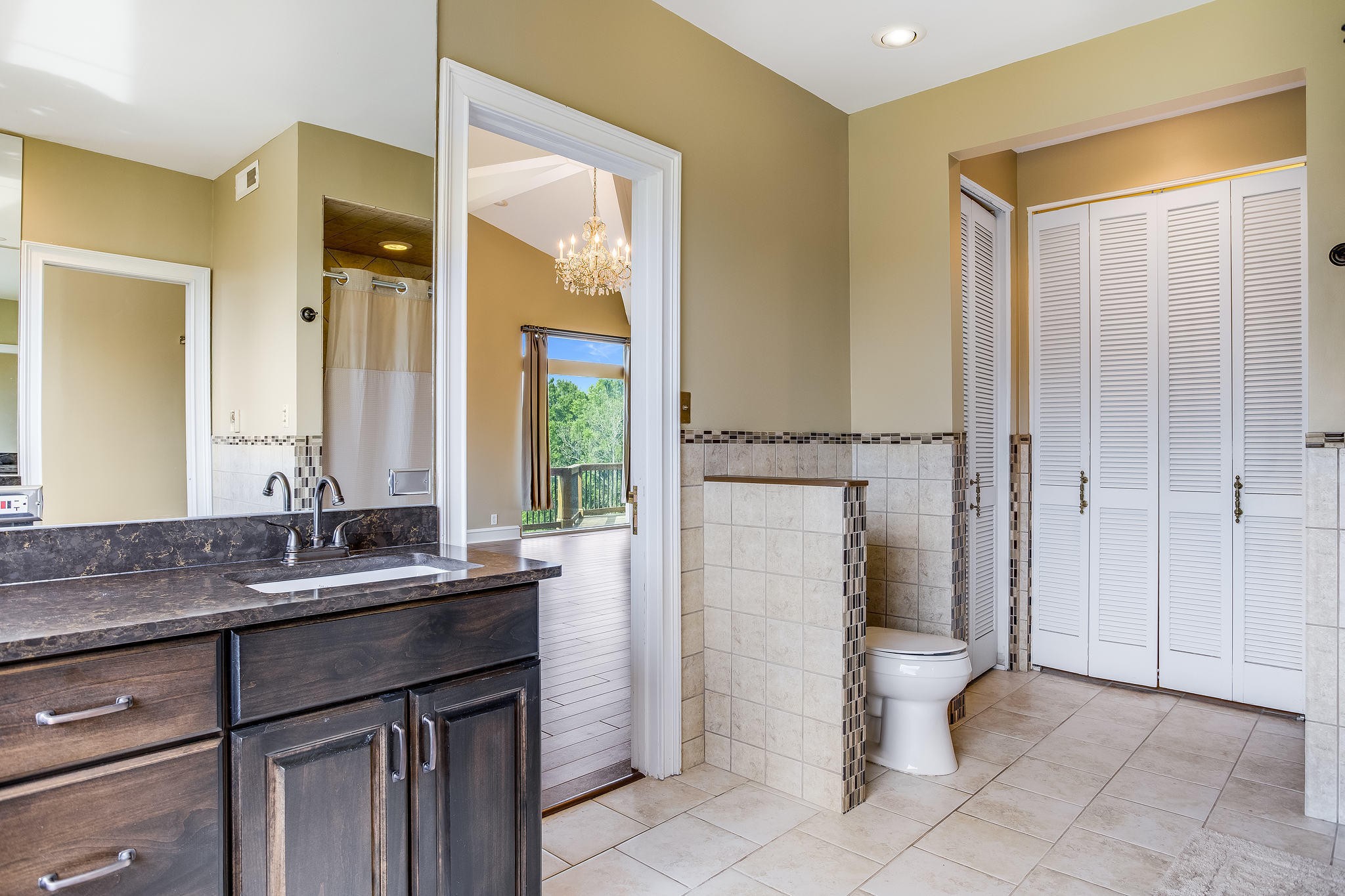 601 Self Hollow Road Rockford, TN 37853 - Photo 15 of 40 a bathroom with a granite countertop sink toilet and shower