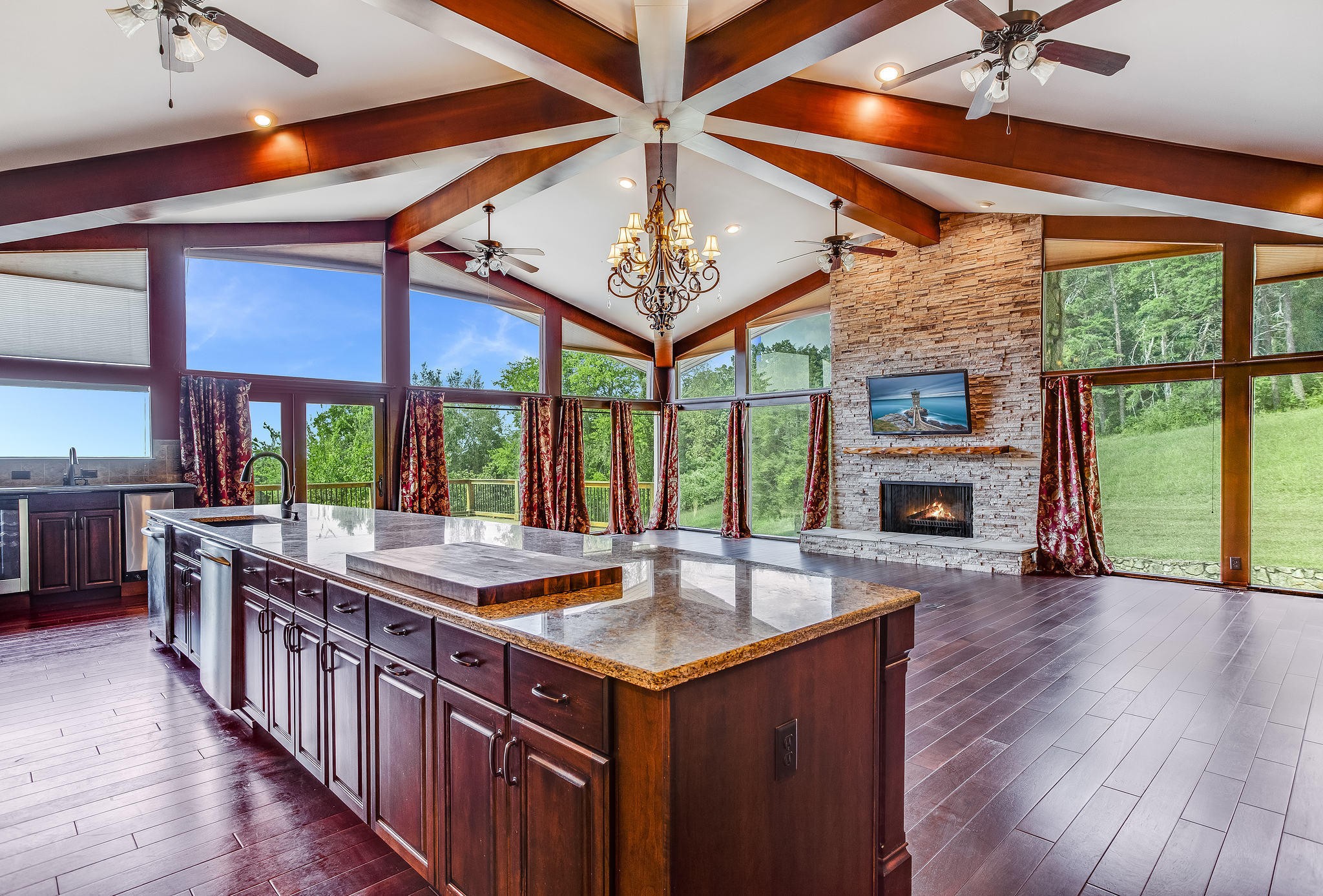 601 Self Hollow Road Rockford, TN 37853 - Photo 19 of 40 an open kitchen with a sink and a fireplace