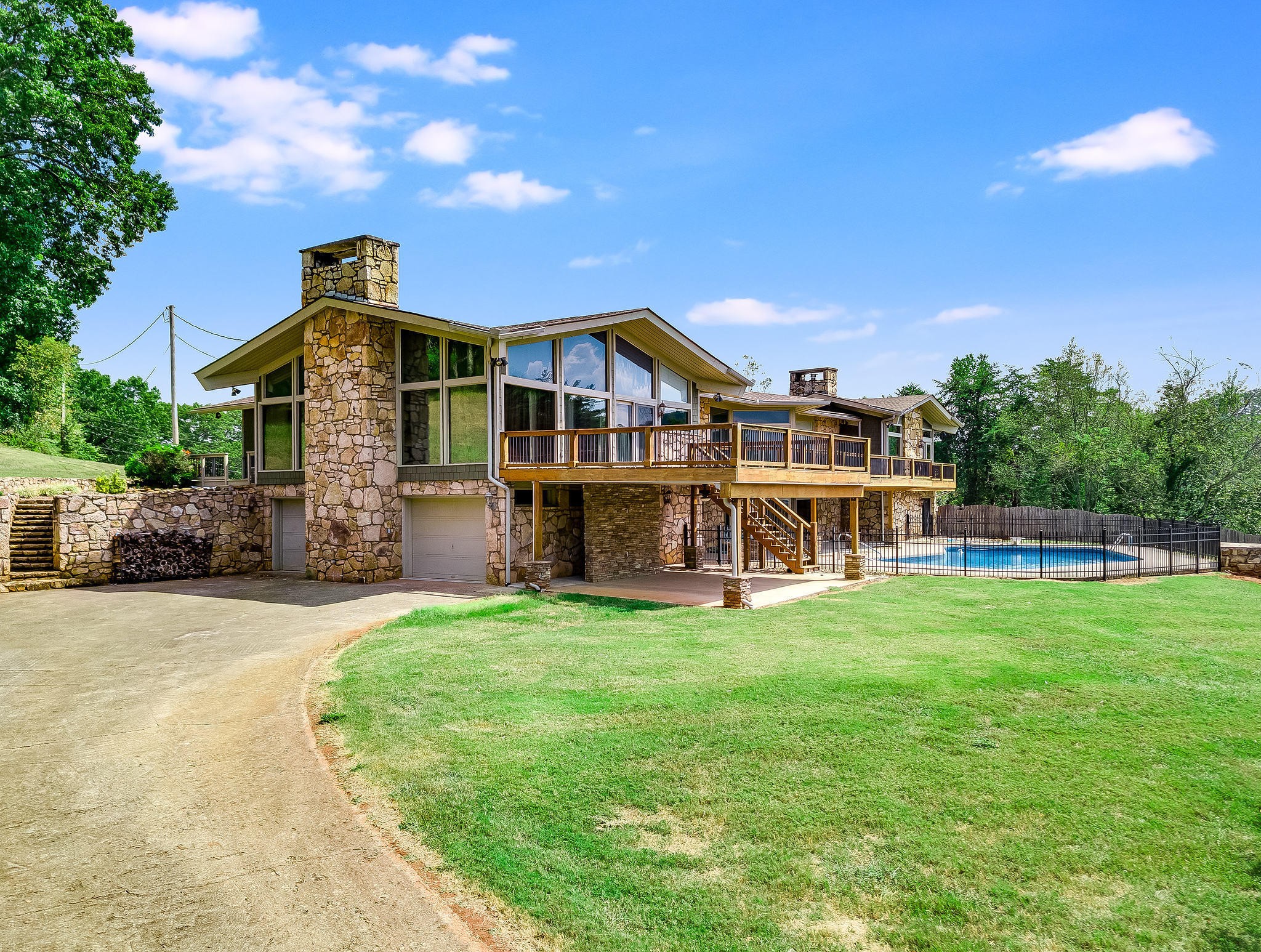 601 Self Hollow Road Rockford, TN 37853 - Photo 2 of 40 a front view of a house with a yard porch and wooden fence