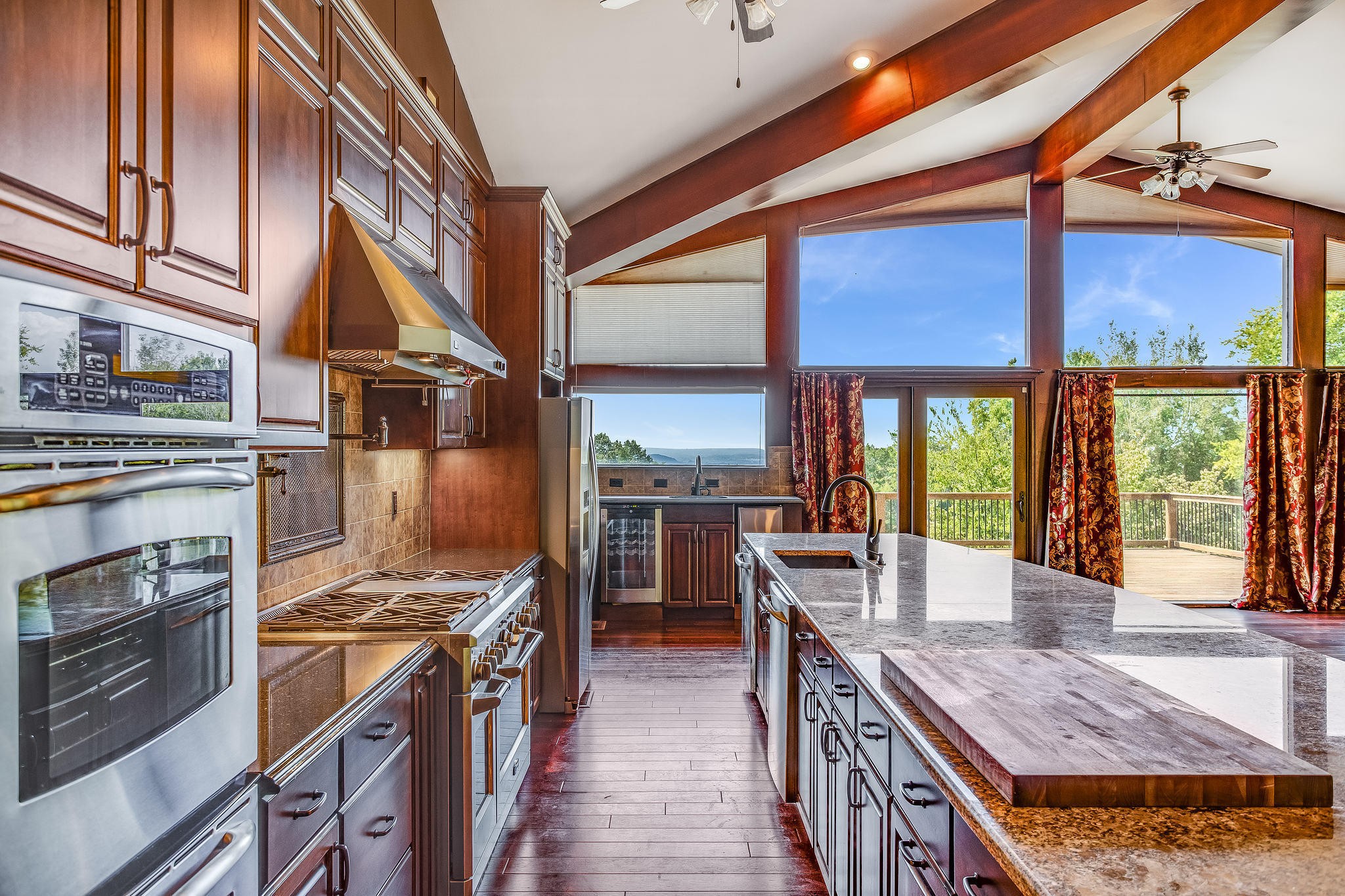 601 Self Hollow Road Rockford, TN 37853 - Photo 21 of 40 a kitchen with stainless steel appliances granite countertop a stove and a refrigerator