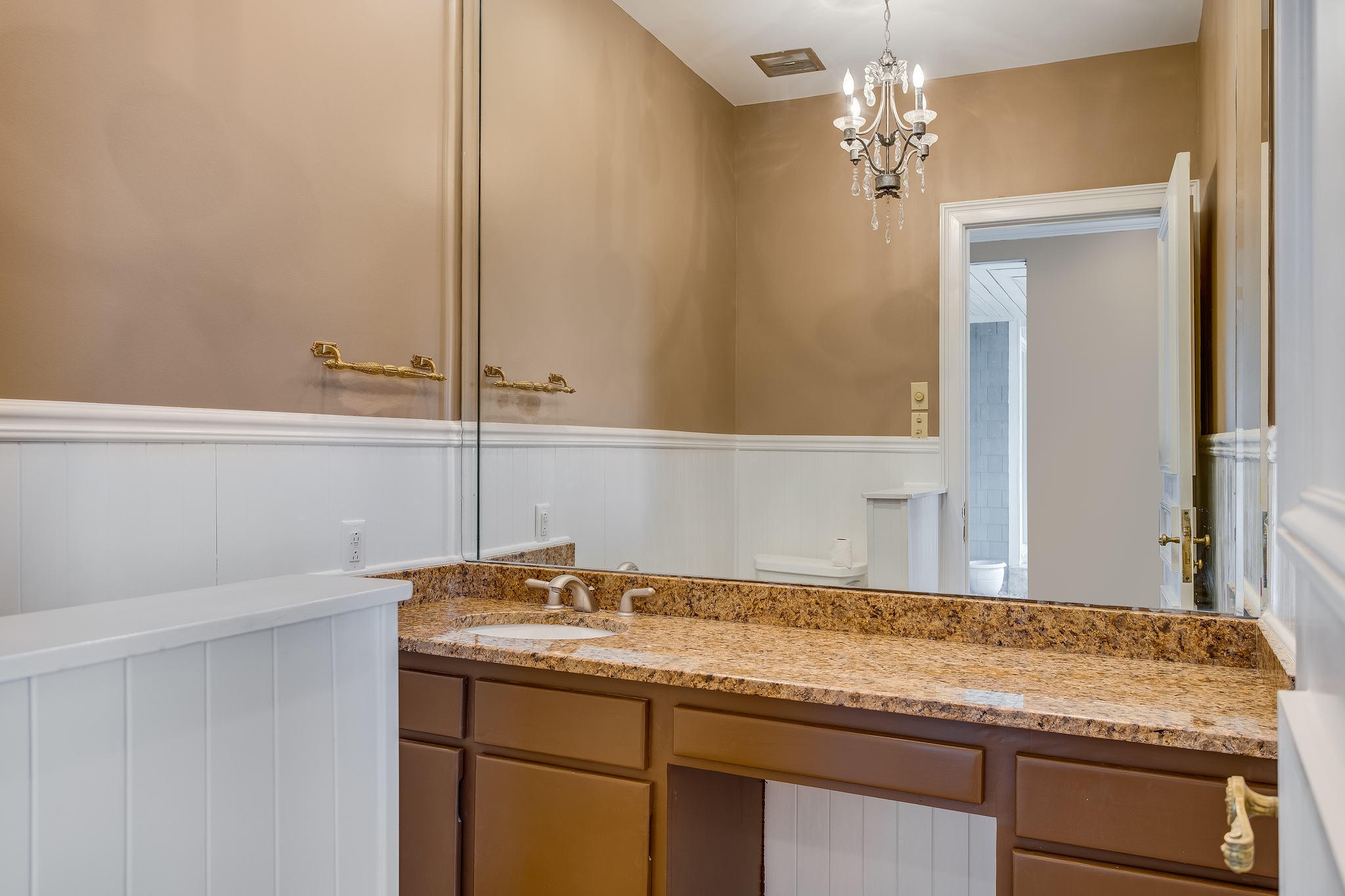 601 Self Hollow Road Rockford, TN 37853 - Photo 22 of 40 a bathroom with a granite countertop sink and a mirror