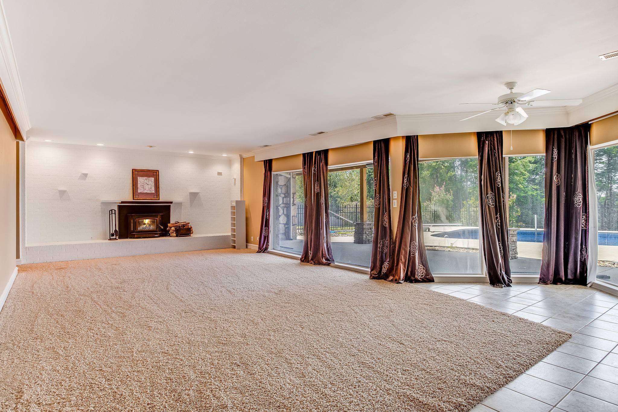 601 Self Hollow Road Rockford, TN 37853 - Photo 29 of 40 a living room with a large bed and large windows