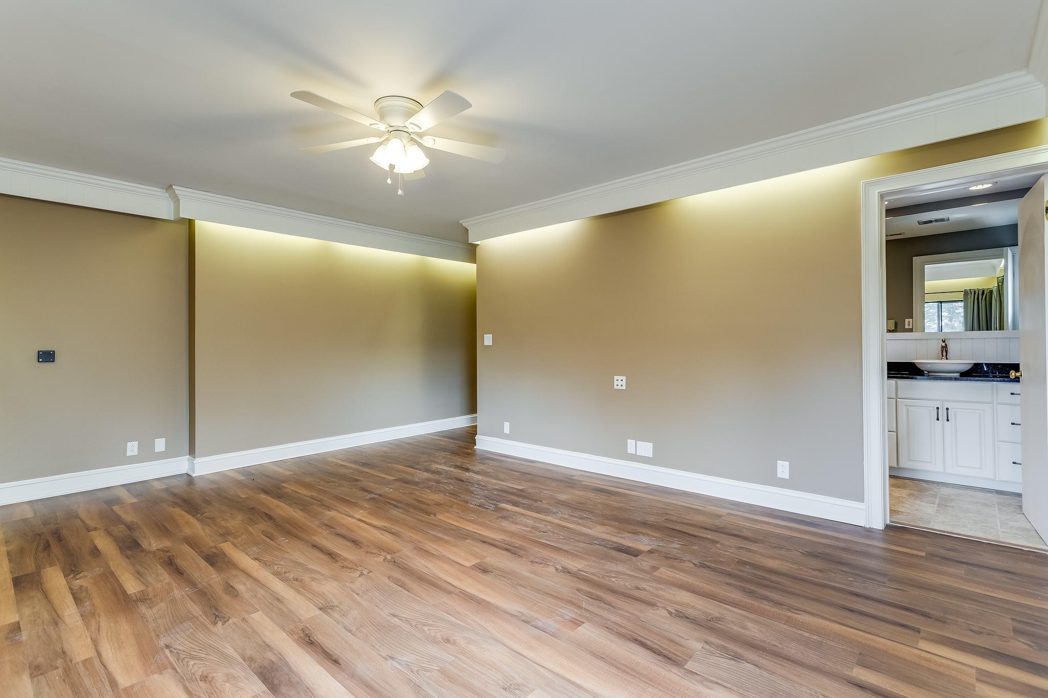 601 Self Hollow Road Rockford, TN 37853 - Photo 34 of 40 a view of an empty room with wooden floor and a ceiling fan