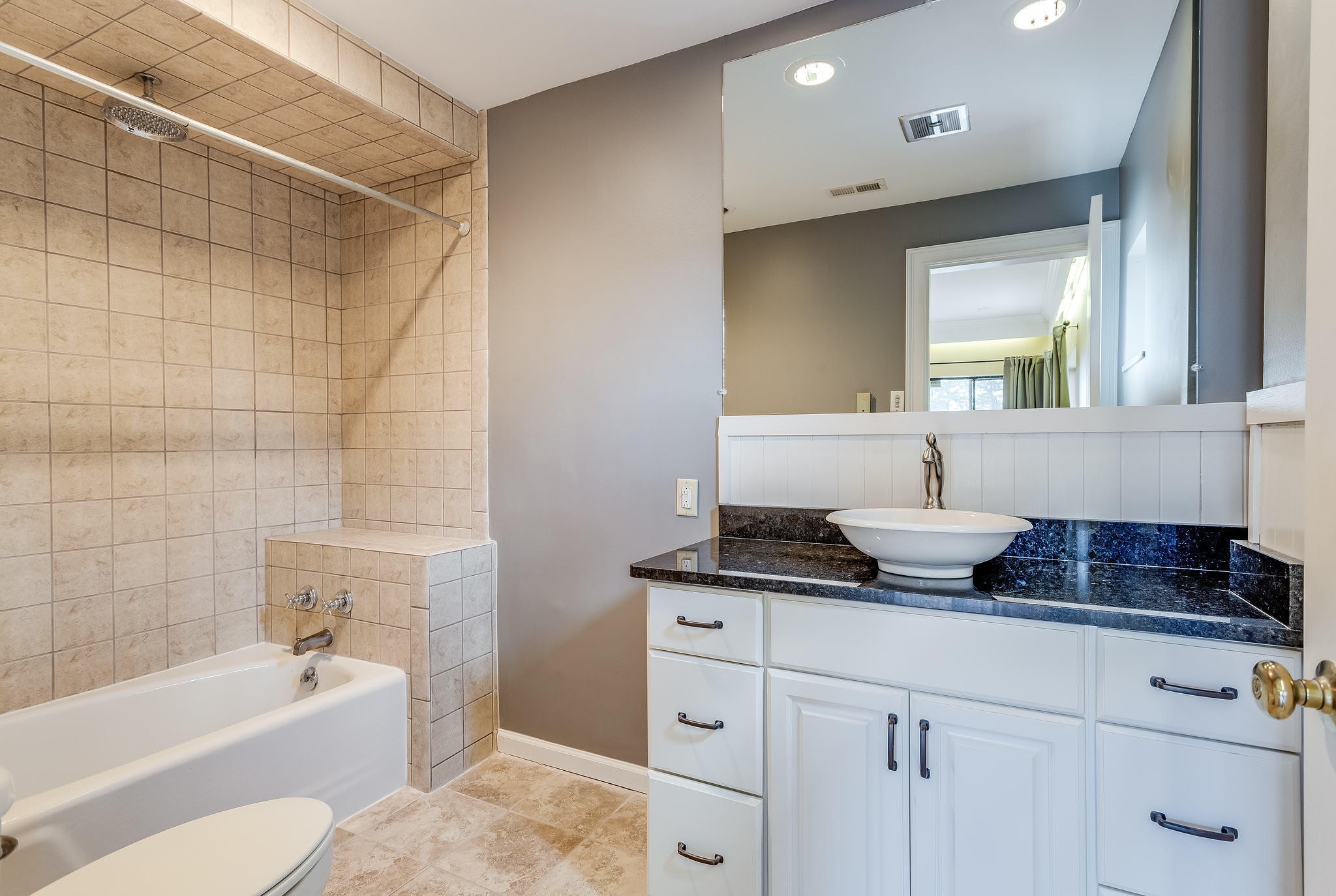 601 Self Hollow Road Rockford, TN 37853 - Photo 35 of 40 a bathroom with a granite countertop sink a toilet and bathtub
