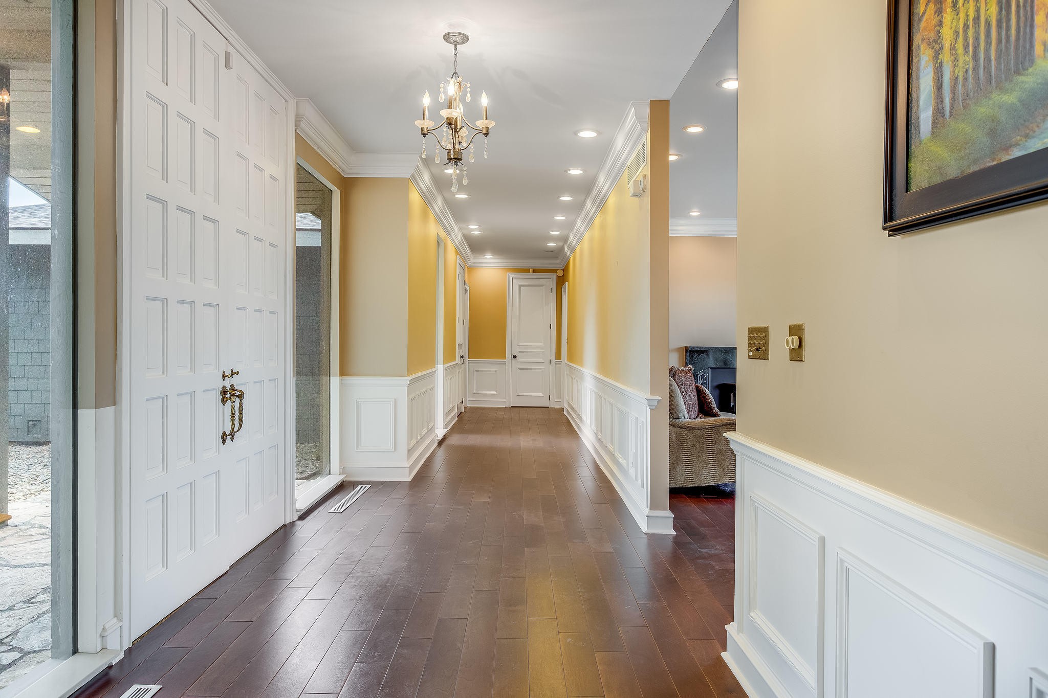 601 Self Hollow Road Rockford, TN 37853 - Photo 8 of 40 a view of a hallway with wooden floor and chandelier