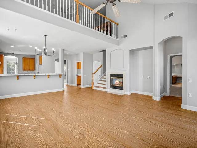 a view of a kitchen with a sink and a fireplace