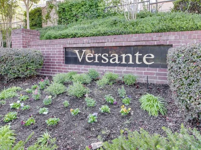 a view of a swimming pool with chairs in patio