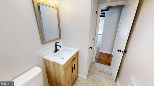 a view of a bathroom from a hallway