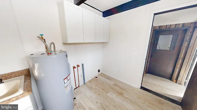 a view of room with furniture and wooden floor