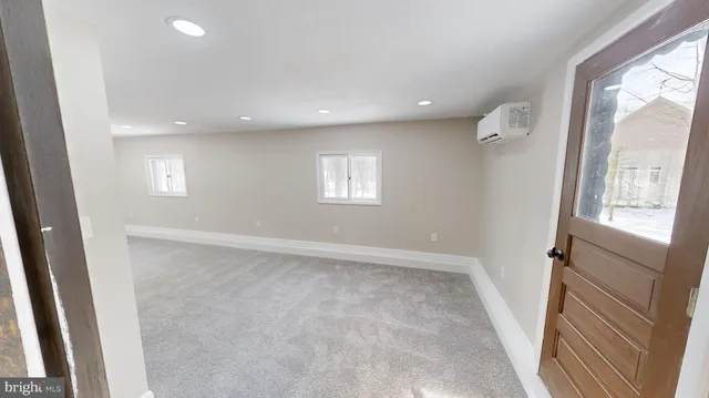 a view of an empty room and a window