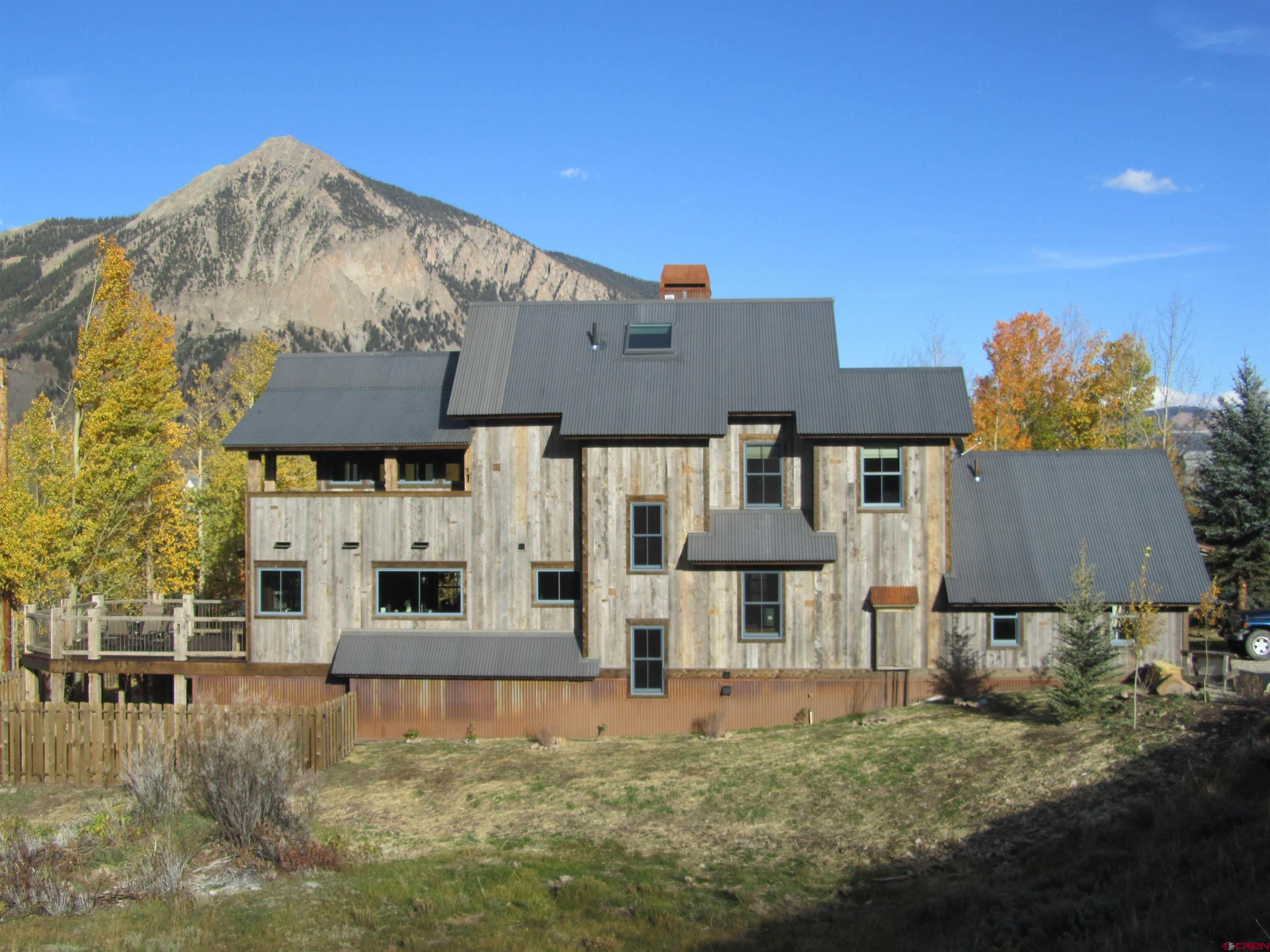 1 Teocalli Avenue Crested Butte, CO 81224 - Photo 1 of 35 a house view with a garden space