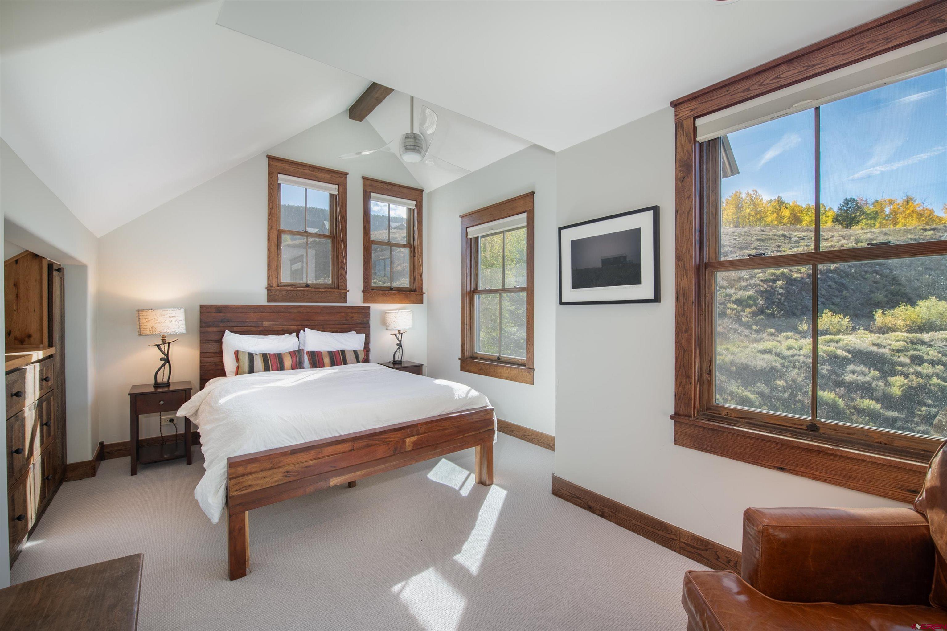 1 Teocalli Avenue Crested Butte, CO 81224 - Photo 20 of 35 a bedroom with a large bed and a window