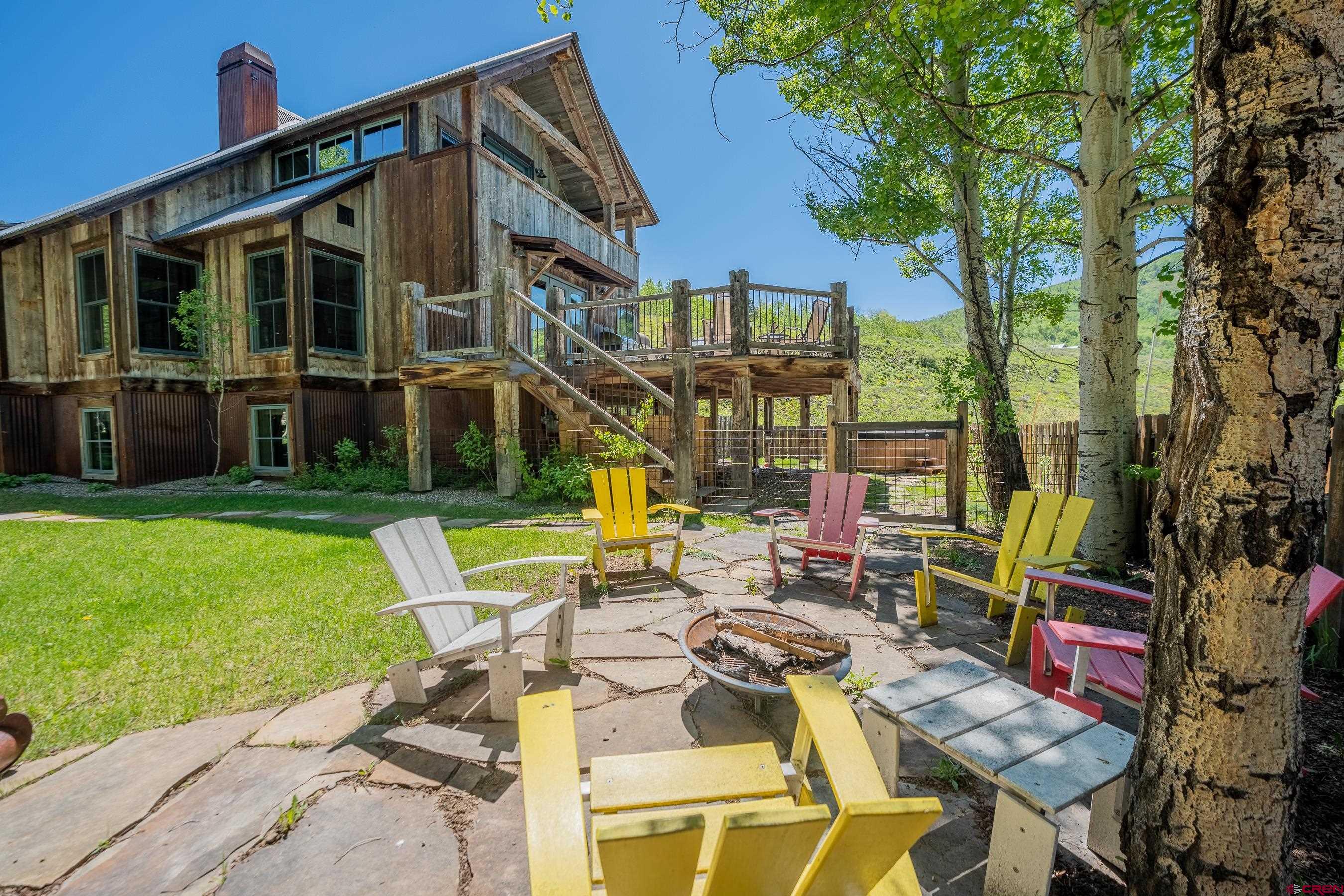 1 Teocalli Avenue Crested Butte, CO 81224 - Photo 2 of 35 a view of a house with backyard porch and sitting area