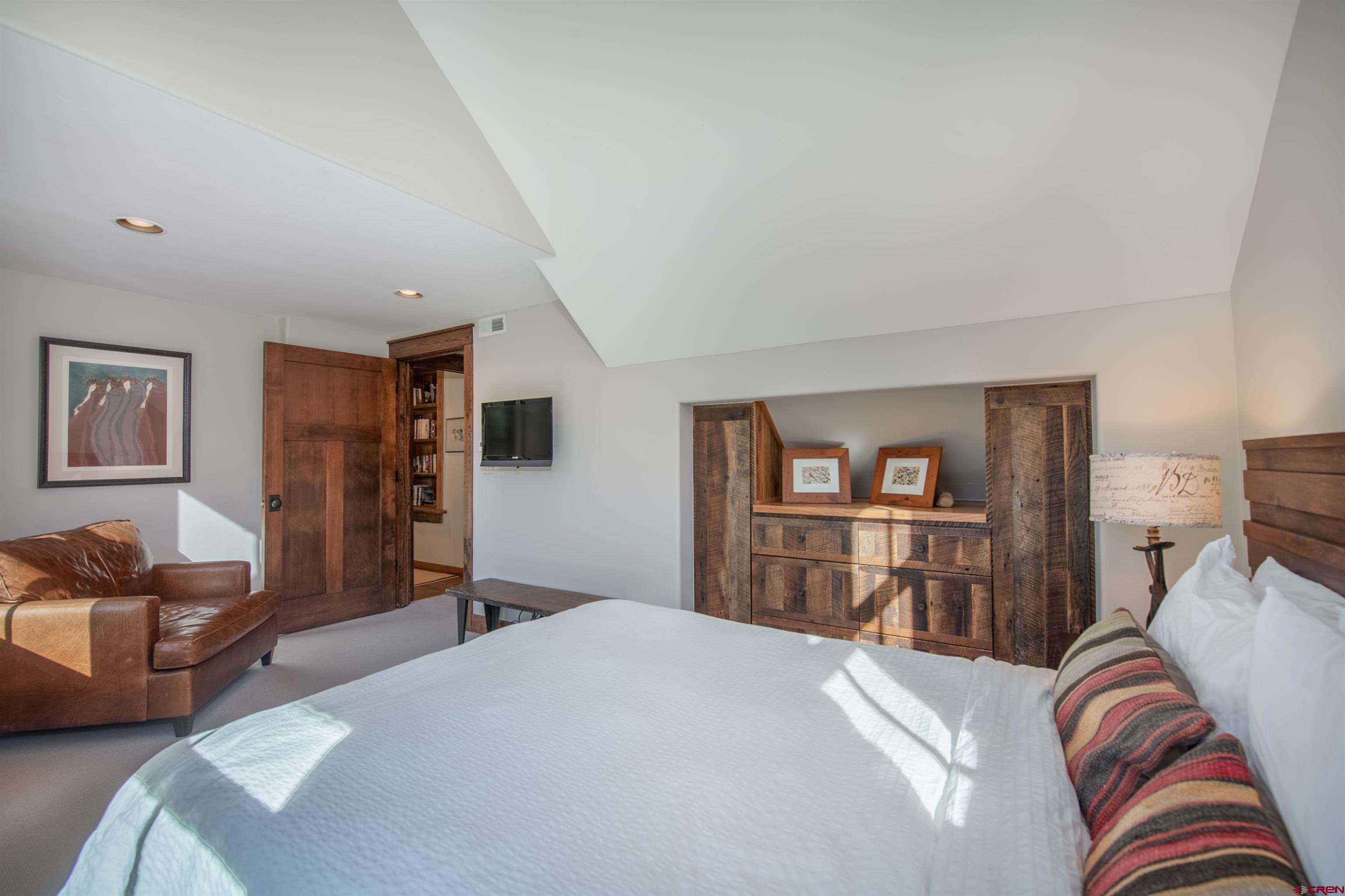 1 Teocalli Avenue Crested Butte, CO 81224 - Photo 21 of 35 a bedroom with furniture and a couch