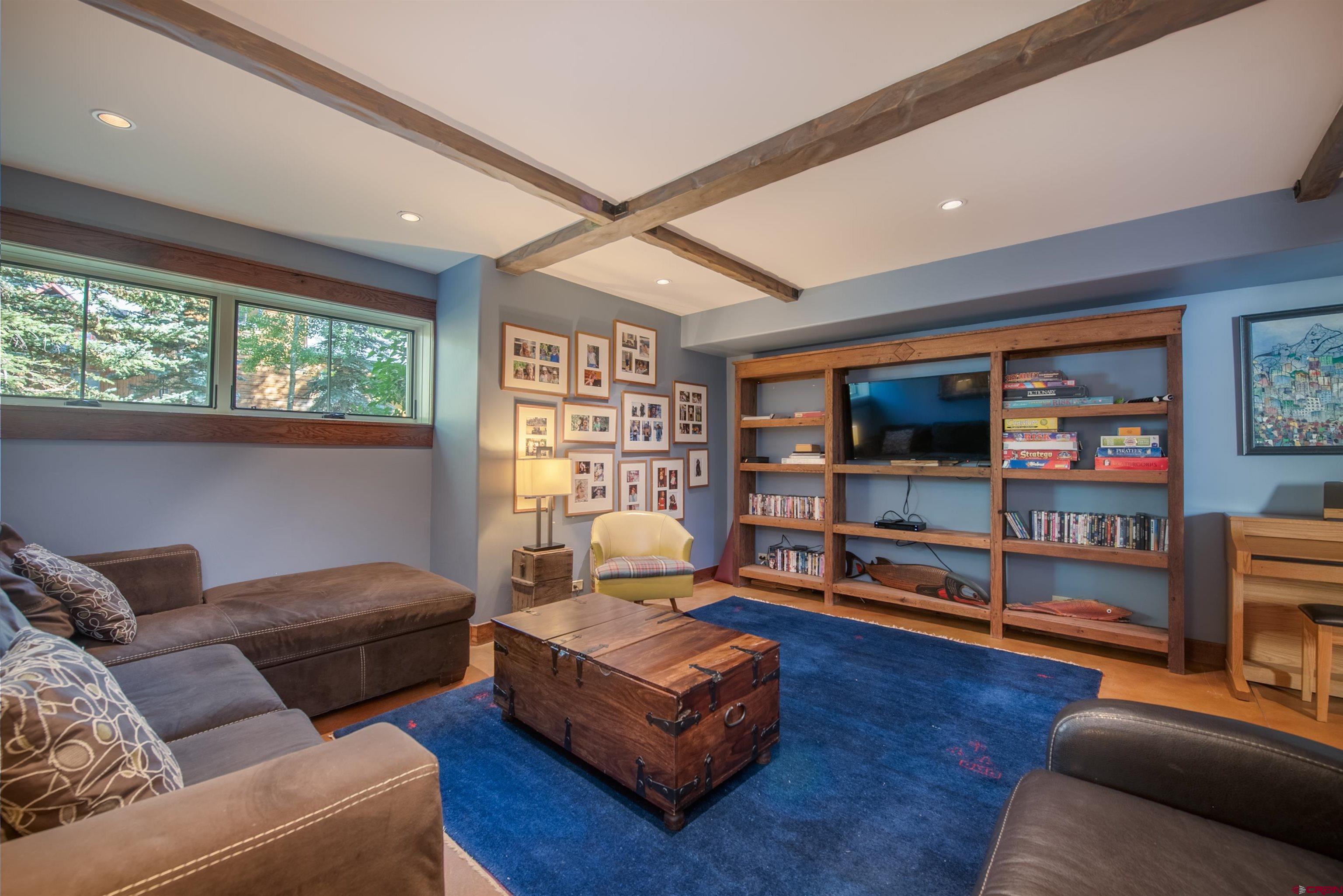 1 Teocalli Avenue Crested Butte, CO 81224 - Photo 25 of 35 a living room with furniture and a flat screen tv