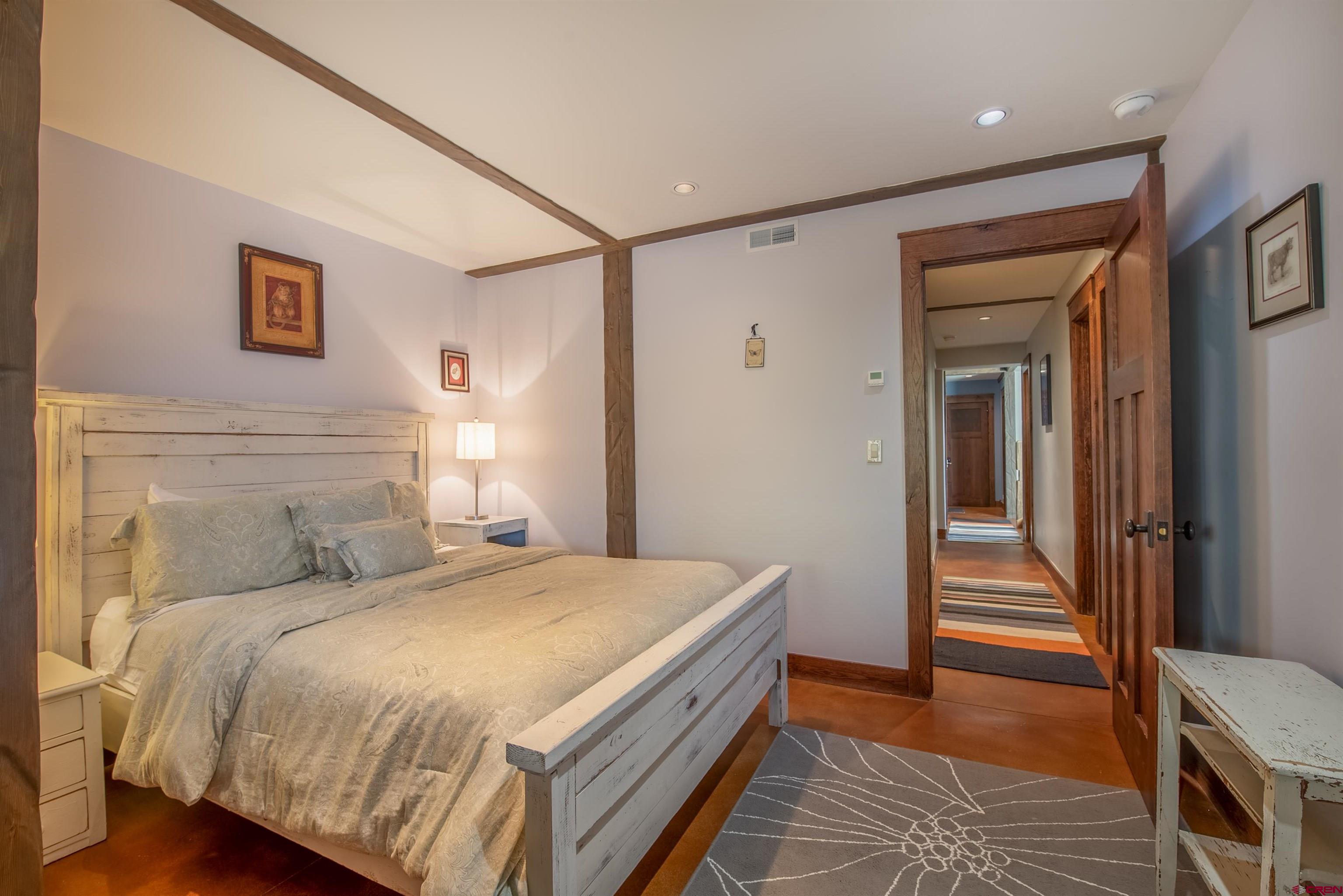 1 Teocalli Avenue Crested Butte, CO 81224 - Photo 27 of 35 a bedroom with a bed and a hallway