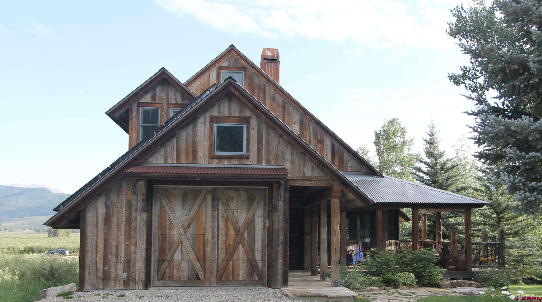 1 Teocalli Avenue Crested Butte, CO 81224 - Photo 31 of 35 a front view of a house with a porch