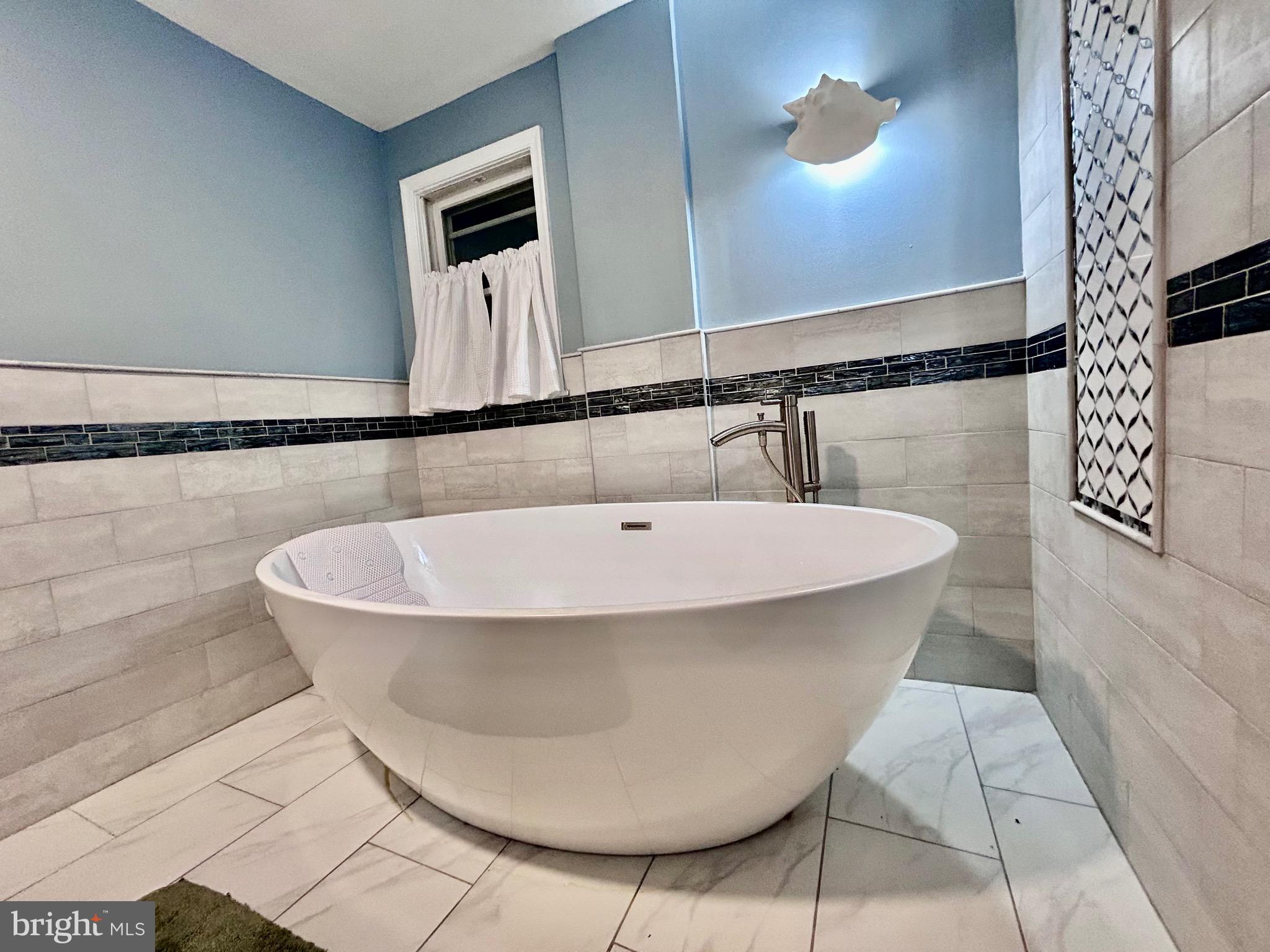 2415 Second Street Pike Newtown, PA 18940 - Photo 33 of 51 a bathroom with a bathtub and a shower