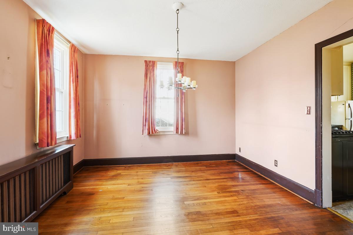 6540 Wiscasset Road Bethesda, MD 20816 - Photo 11 of 33 a view of a room with wooden floor and window