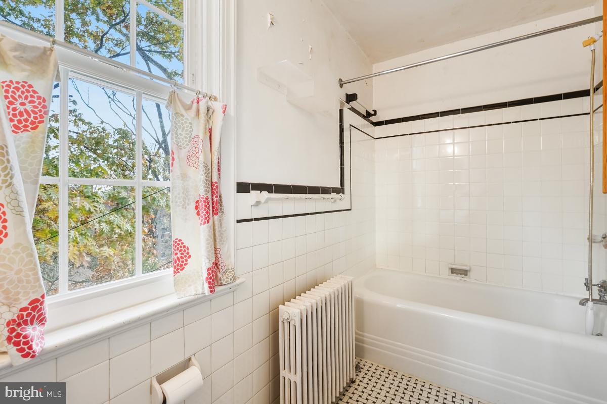 6540 Wiscasset Road Bethesda, MD 20816 - Photo 27 of 33 a bathroom with a bathtub and a shower